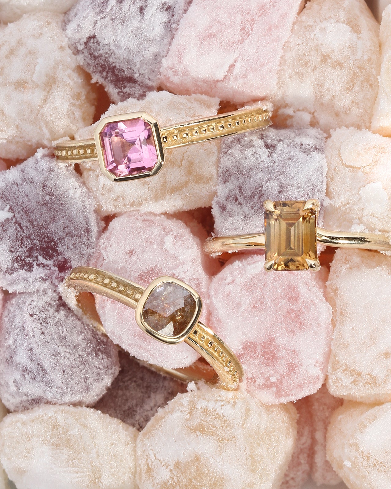 3 gold rings with gemstones