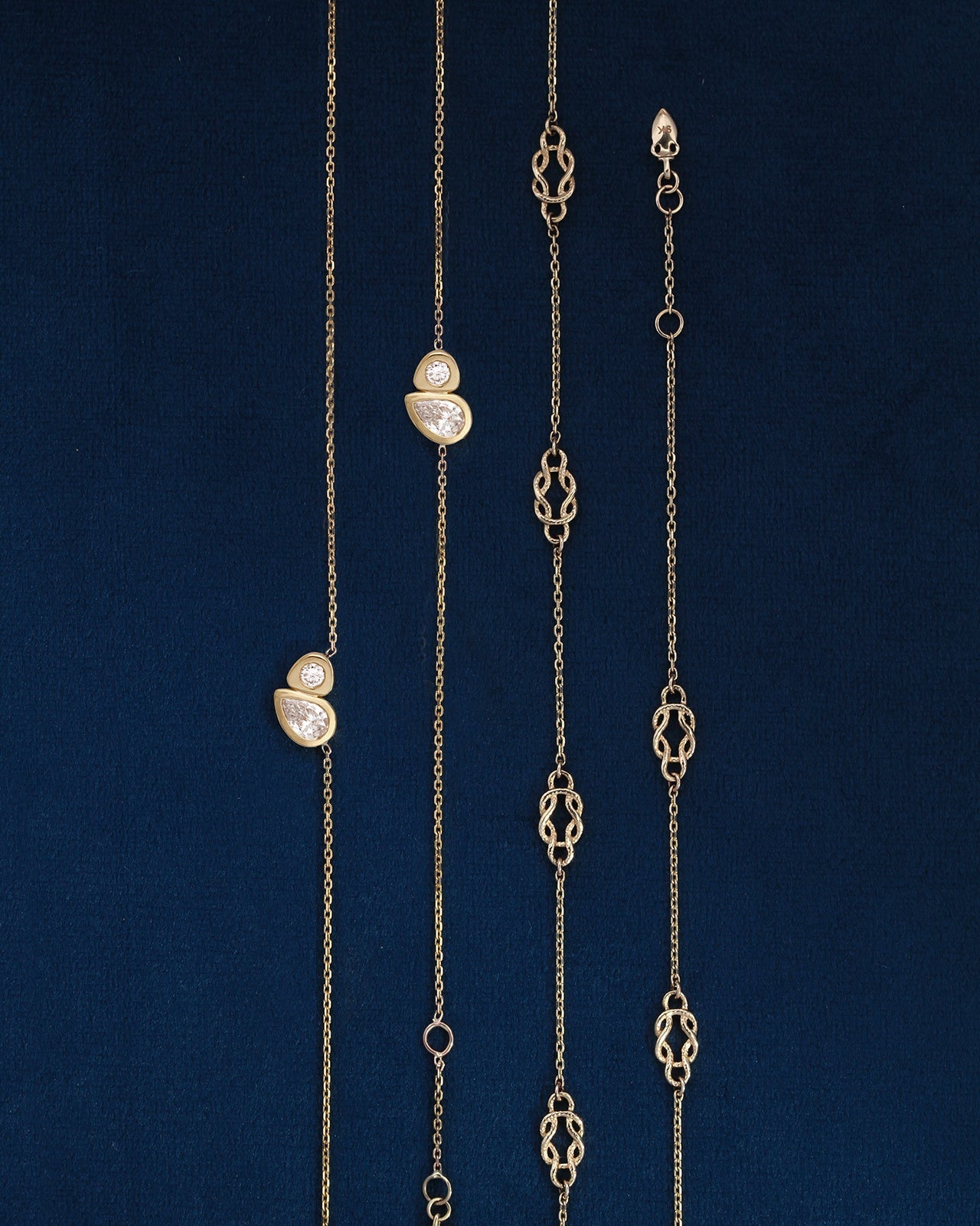 4 chain bracelets side by side with diamonds