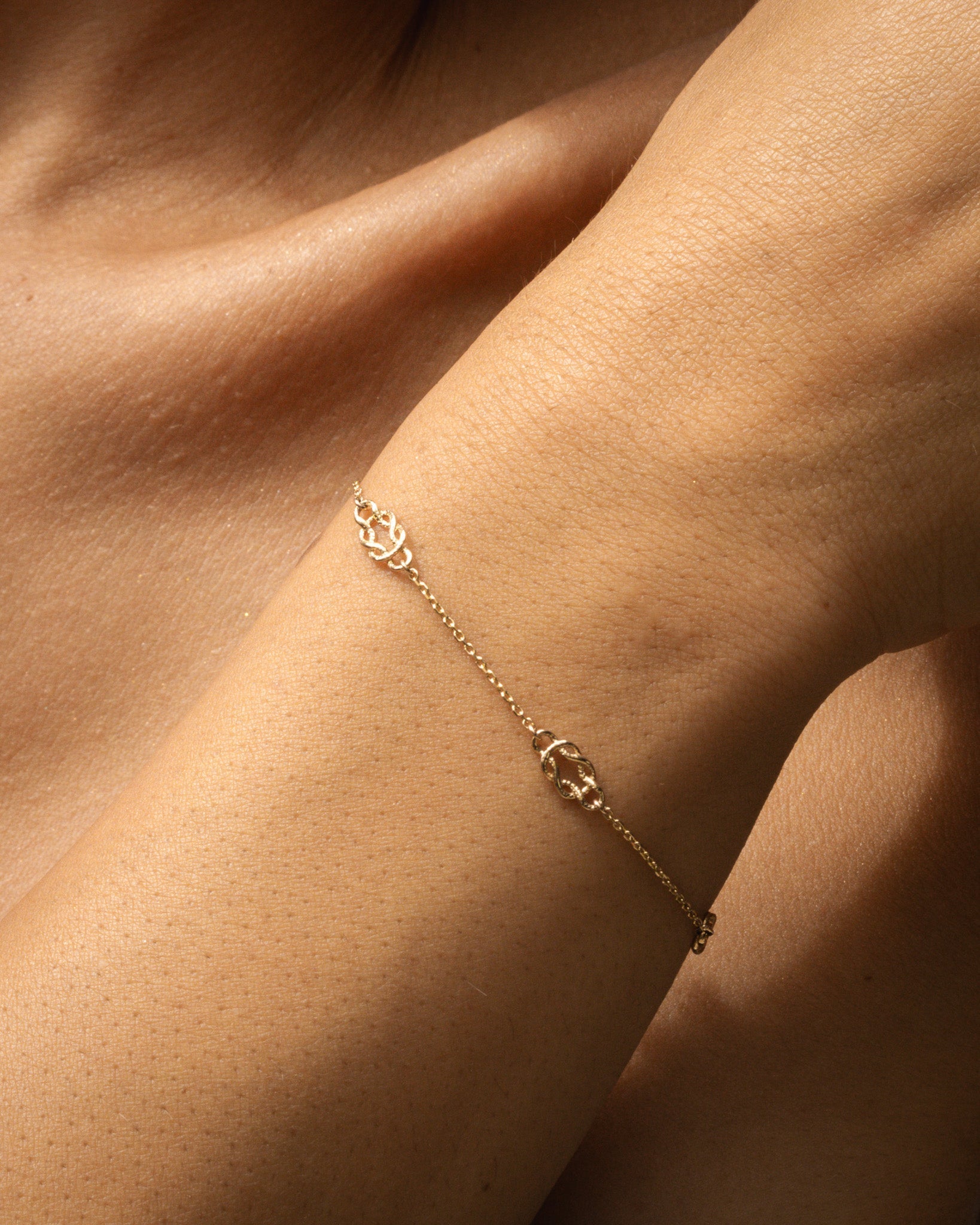 solid gold bracelet on wrist