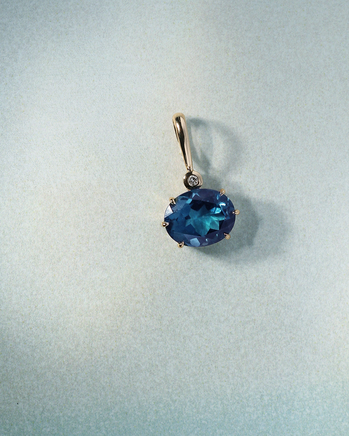 Astra Teal Topaz and Diamond Pendant Solid Gold, flatlay