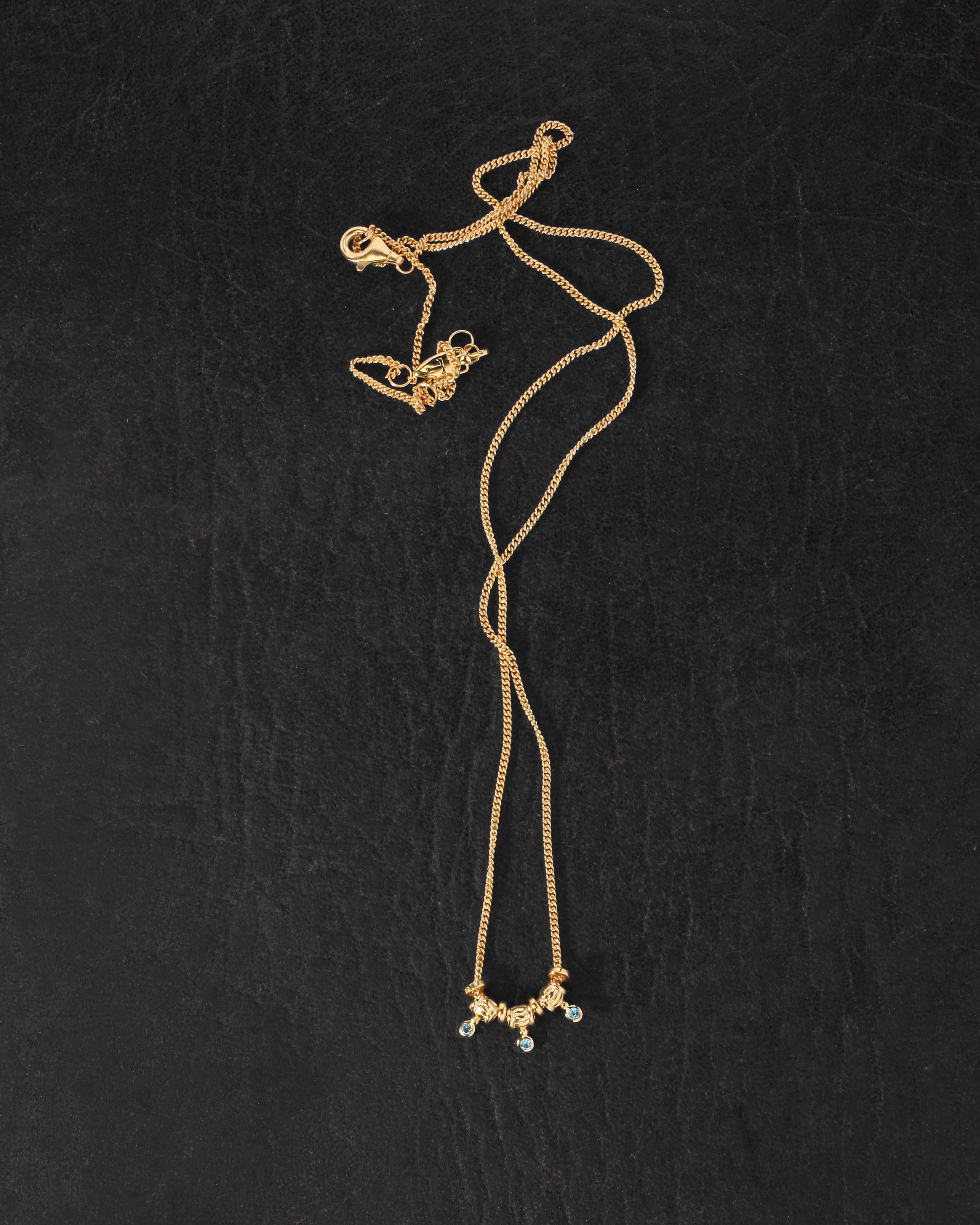 Isla Necklace Gold Vermeil on dark leather