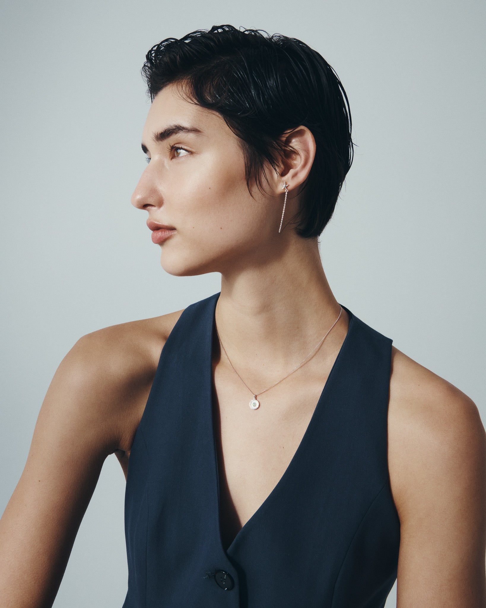 Seba Stud Earrings and Soma Coin Necklace in Silver, worn
