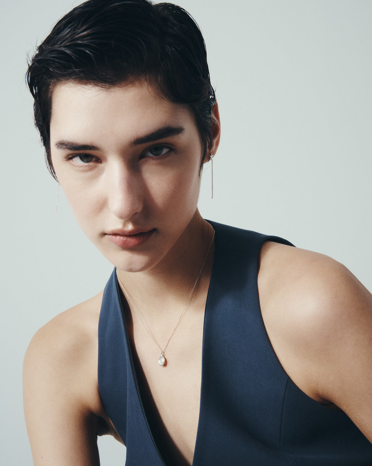 Seba Stud Earrings and Soma Coin Necklace in Silver, worn