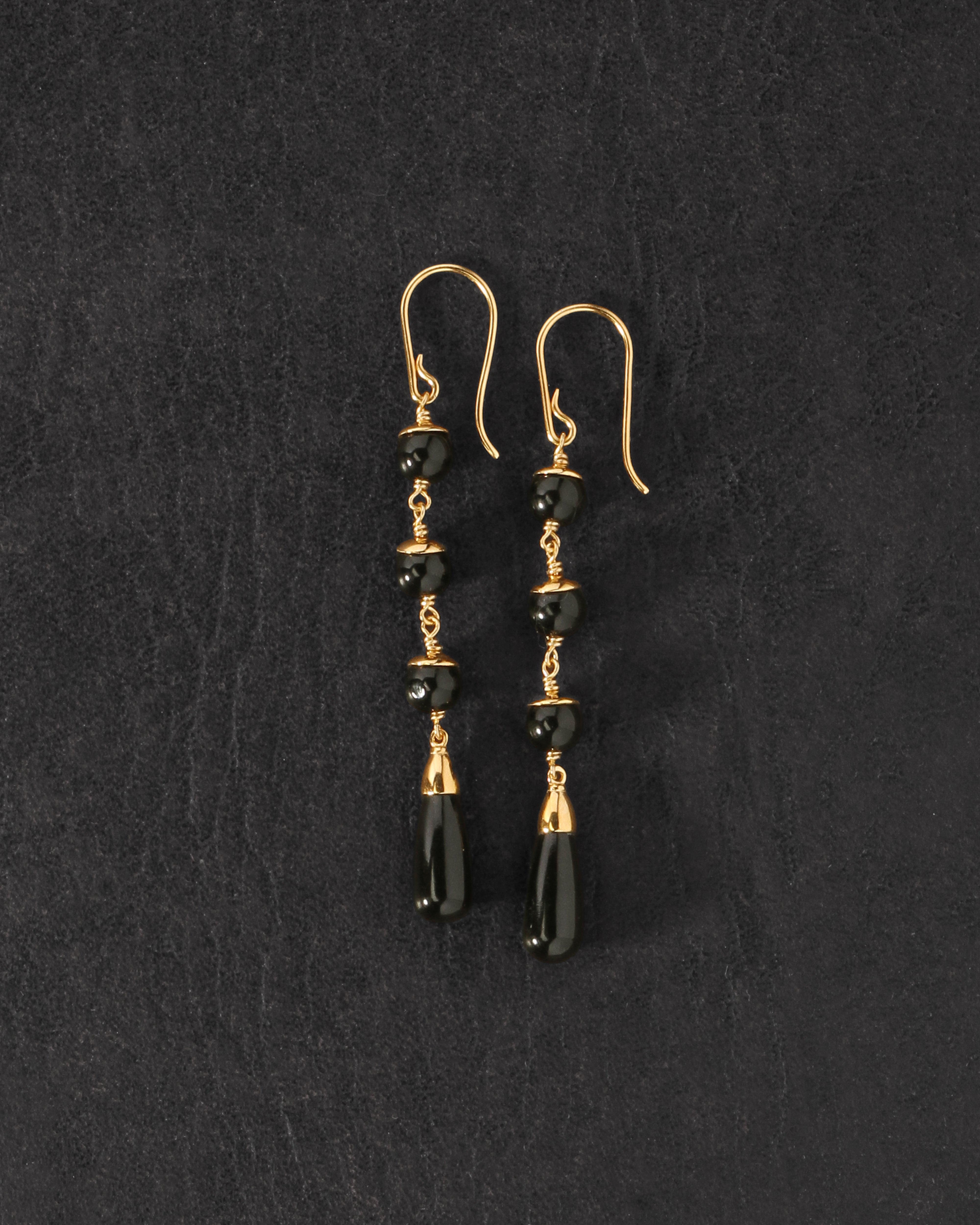 Sita Earrings Gold Vermeil on dark leather