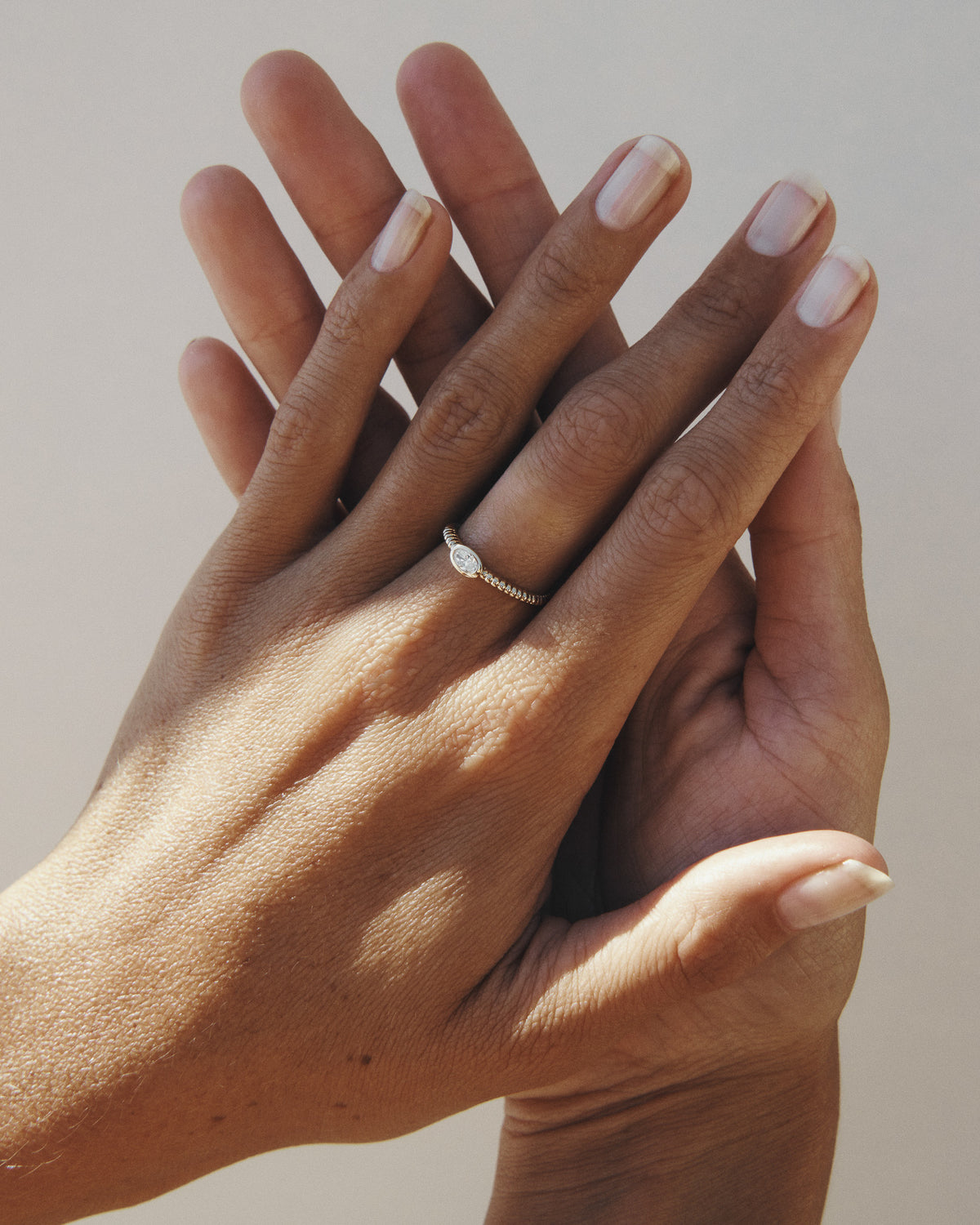 Wren Diamond Solitaire Ring Solid Gold, worn on the hand