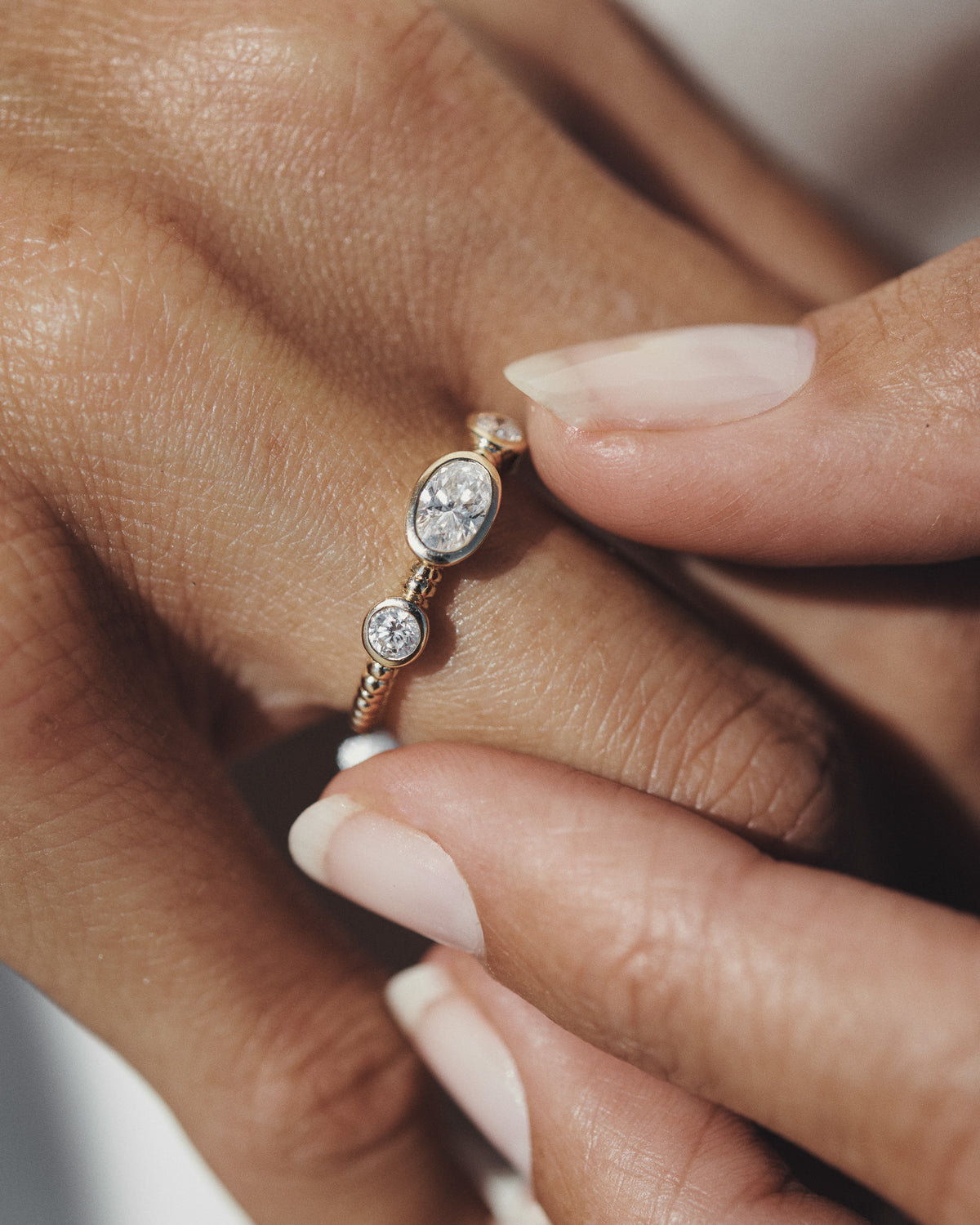 Wren Diamond Trilogy Ring Solid Gold, worn on the hand