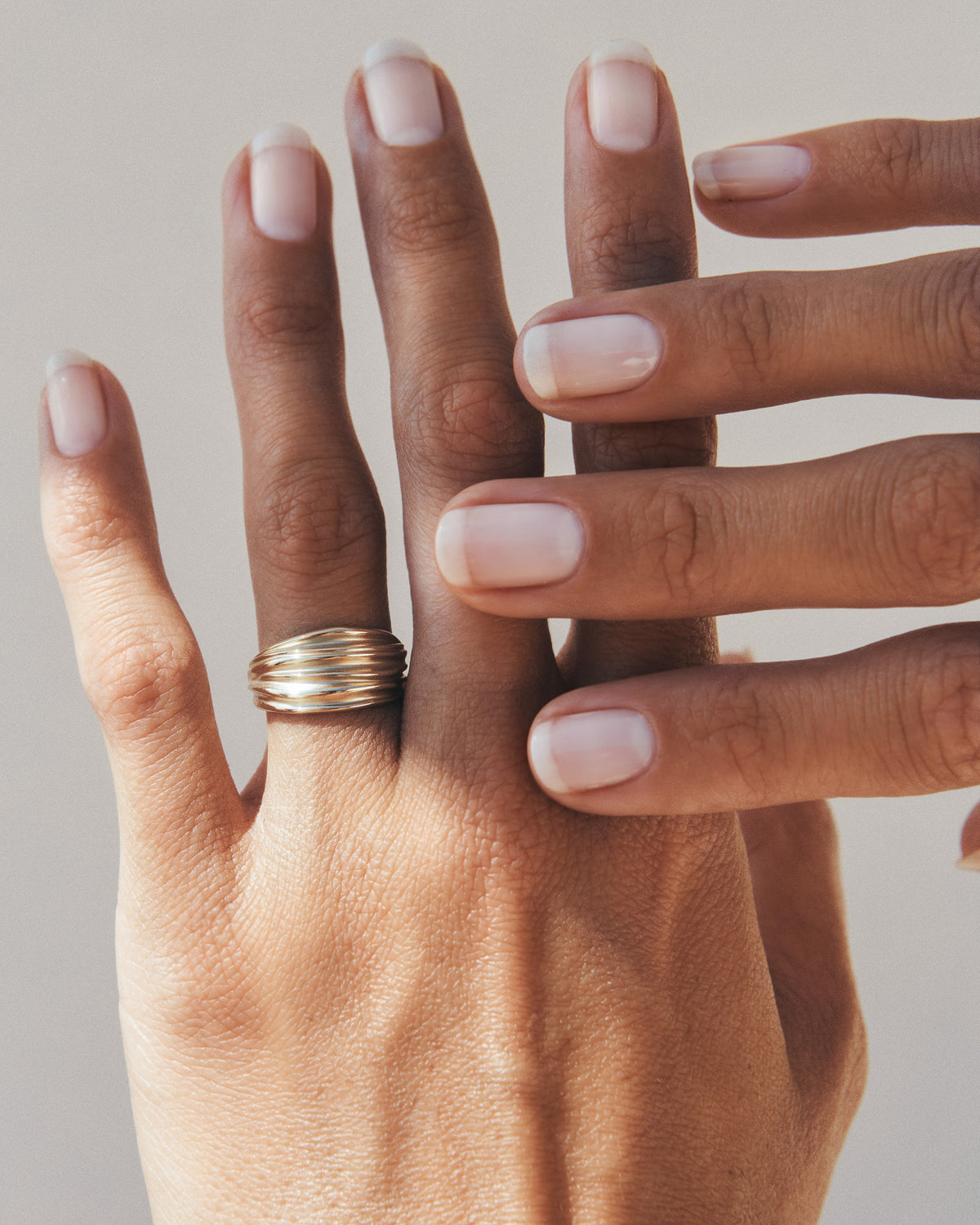 Arc Ring Solid Gold, worn on the hand