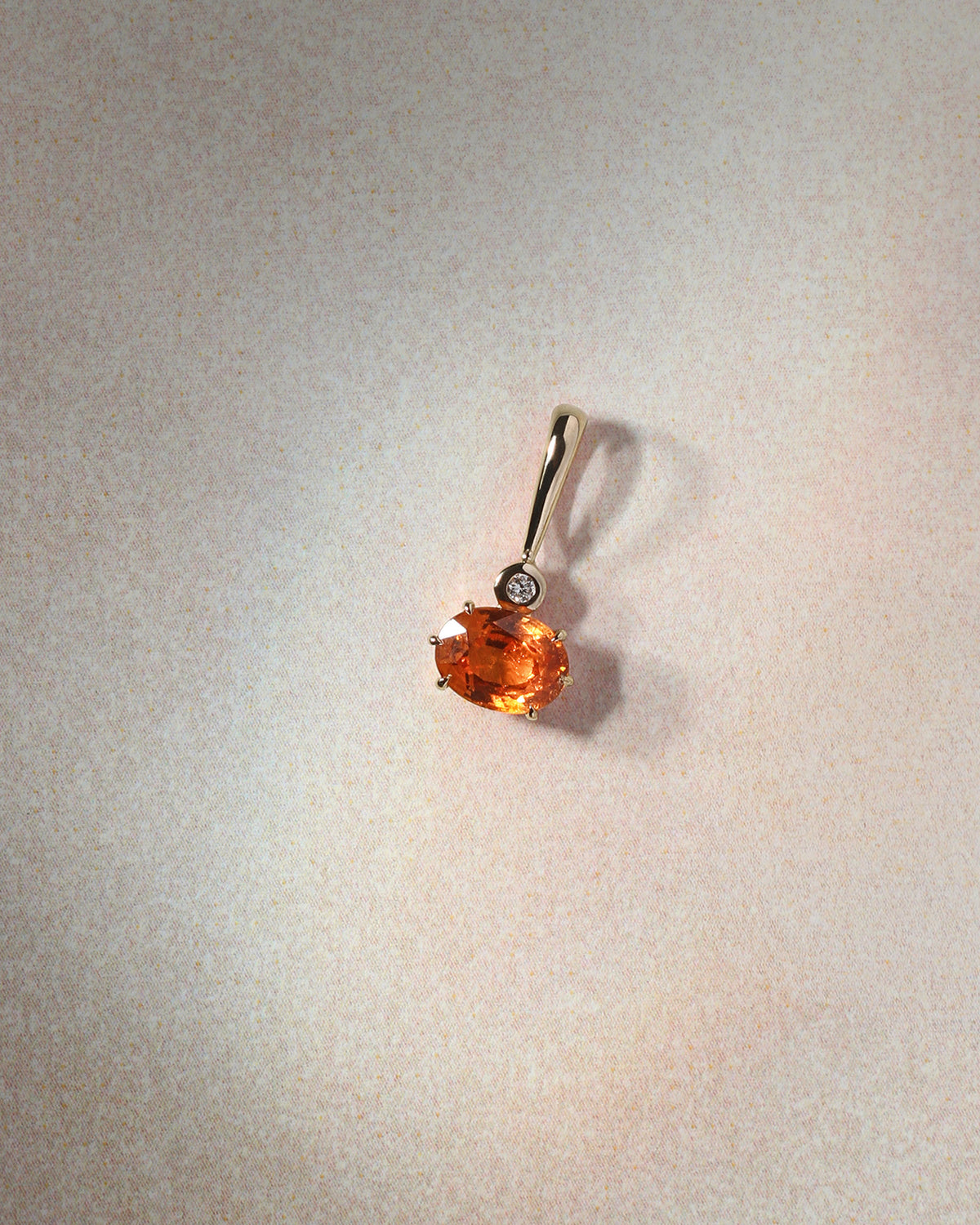 Astra Spessartite and Diamond Pendant Solid Gold, flatlay