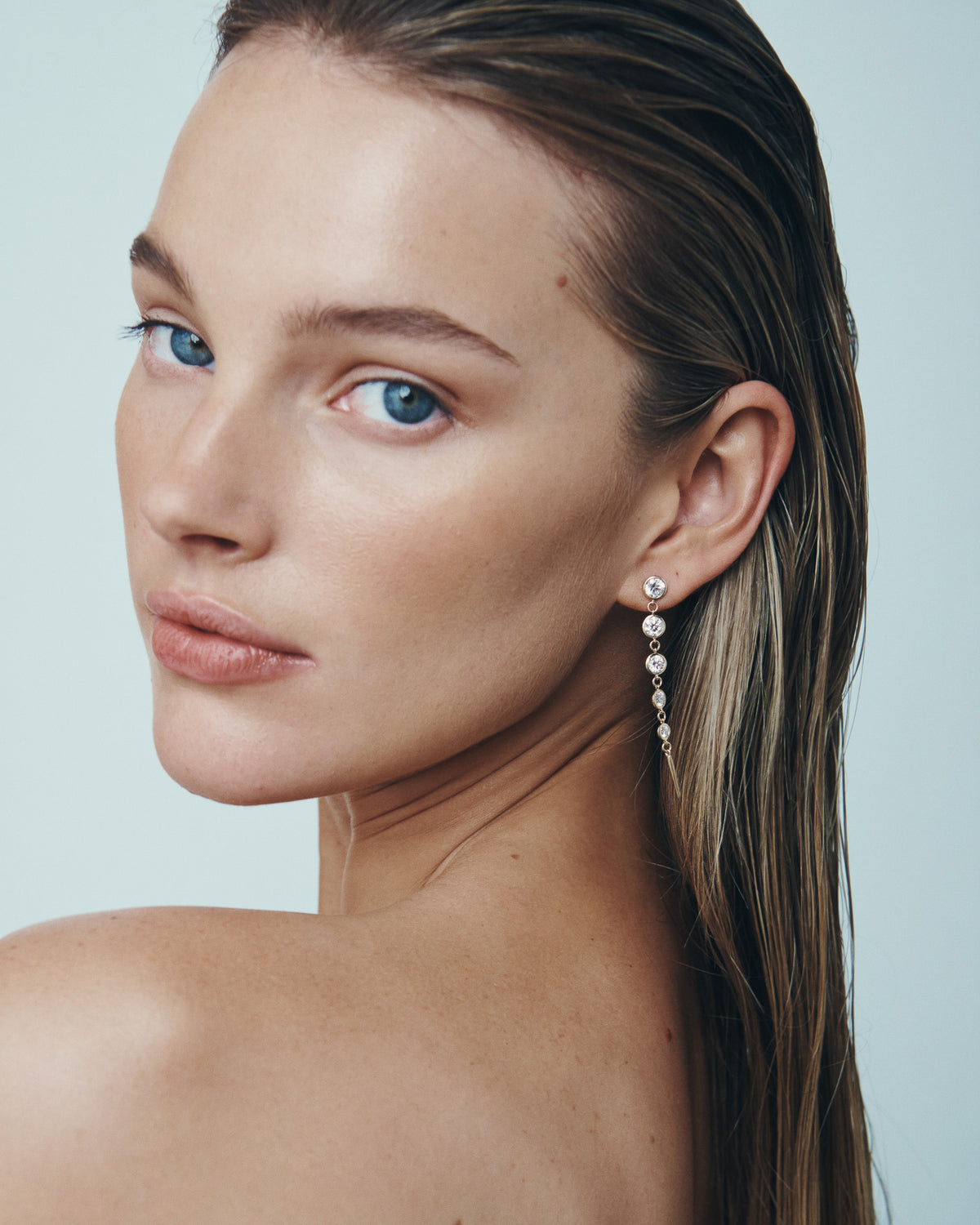 Aten Diamond Earrings Solid Gold, worn with hair back