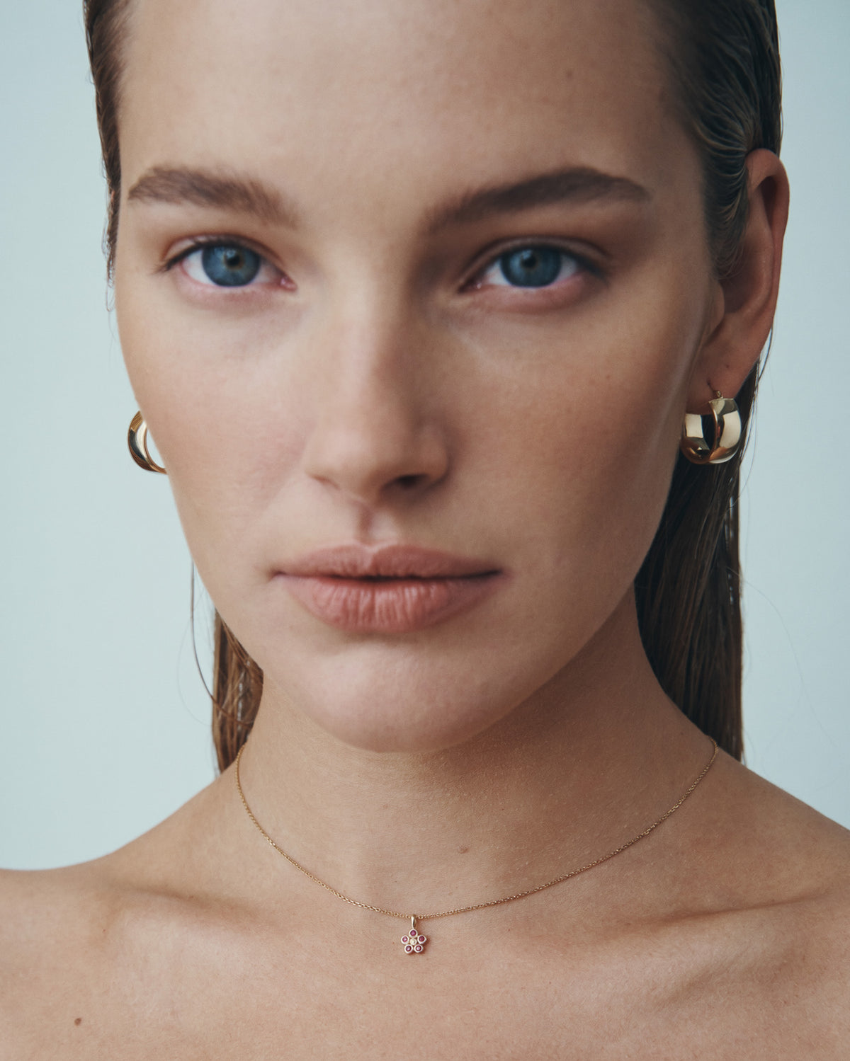 Daisy Ruby Necklace and Greta Hoops Solid Gold, worn