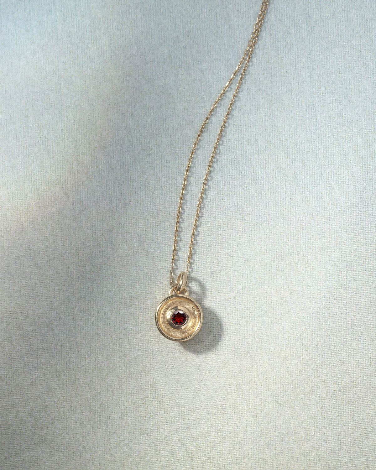 Element Fire Garnet Necklace Solid Gold, flatlay