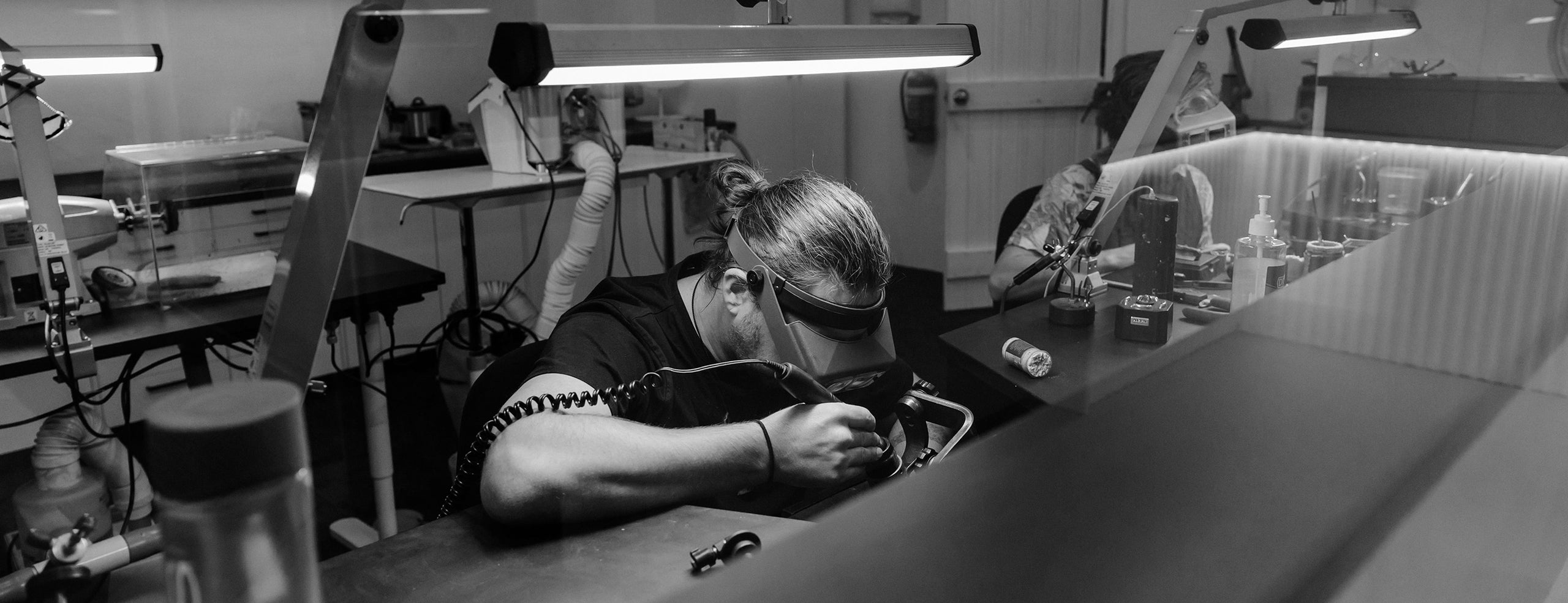 jeweller working in our solid gold studio in byron bay