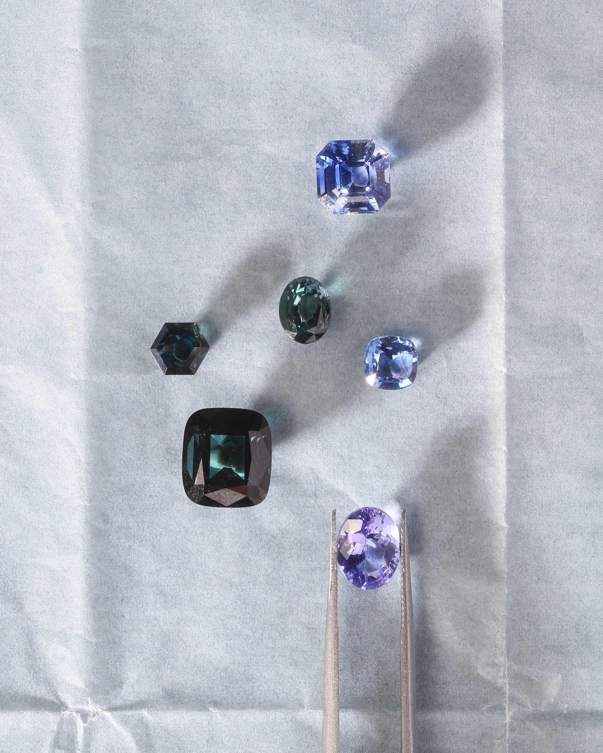 Collection of gemstones on a light gray background