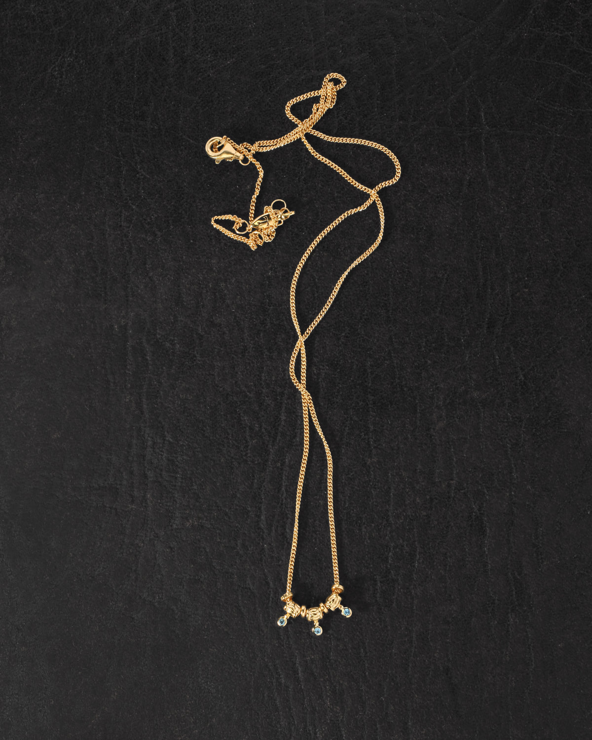 Isla Necklace Gold Vermeil on dark leather