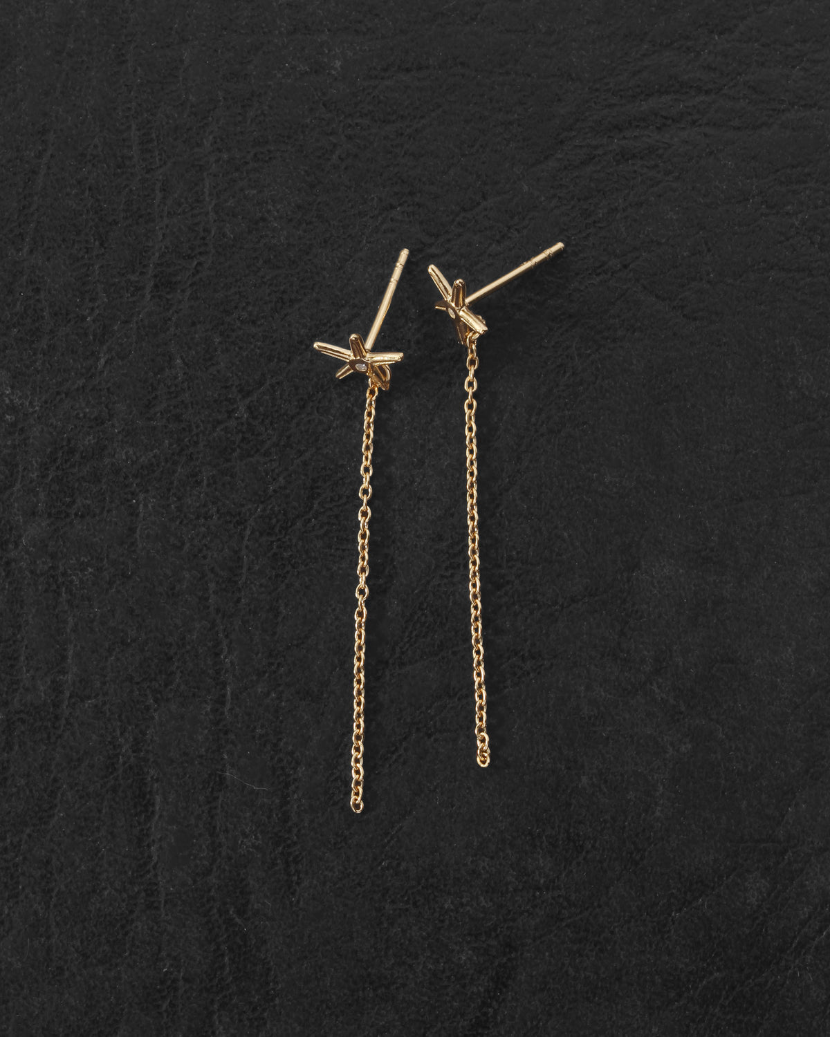 Seba Stud Earrings Gold Vermeil on dark leather