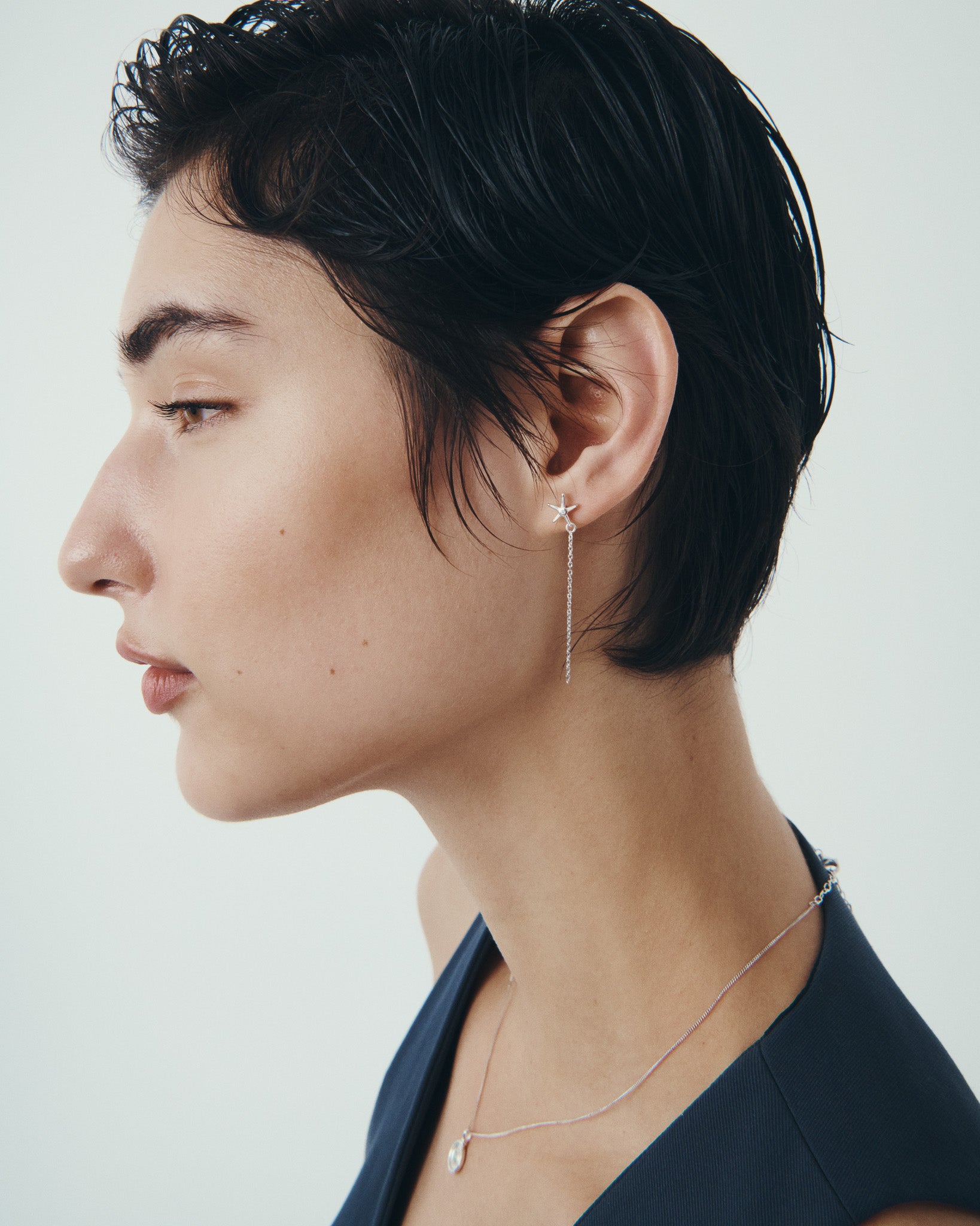 Seba Stud Earrings and Soma Coin Necklace in Silver, worn