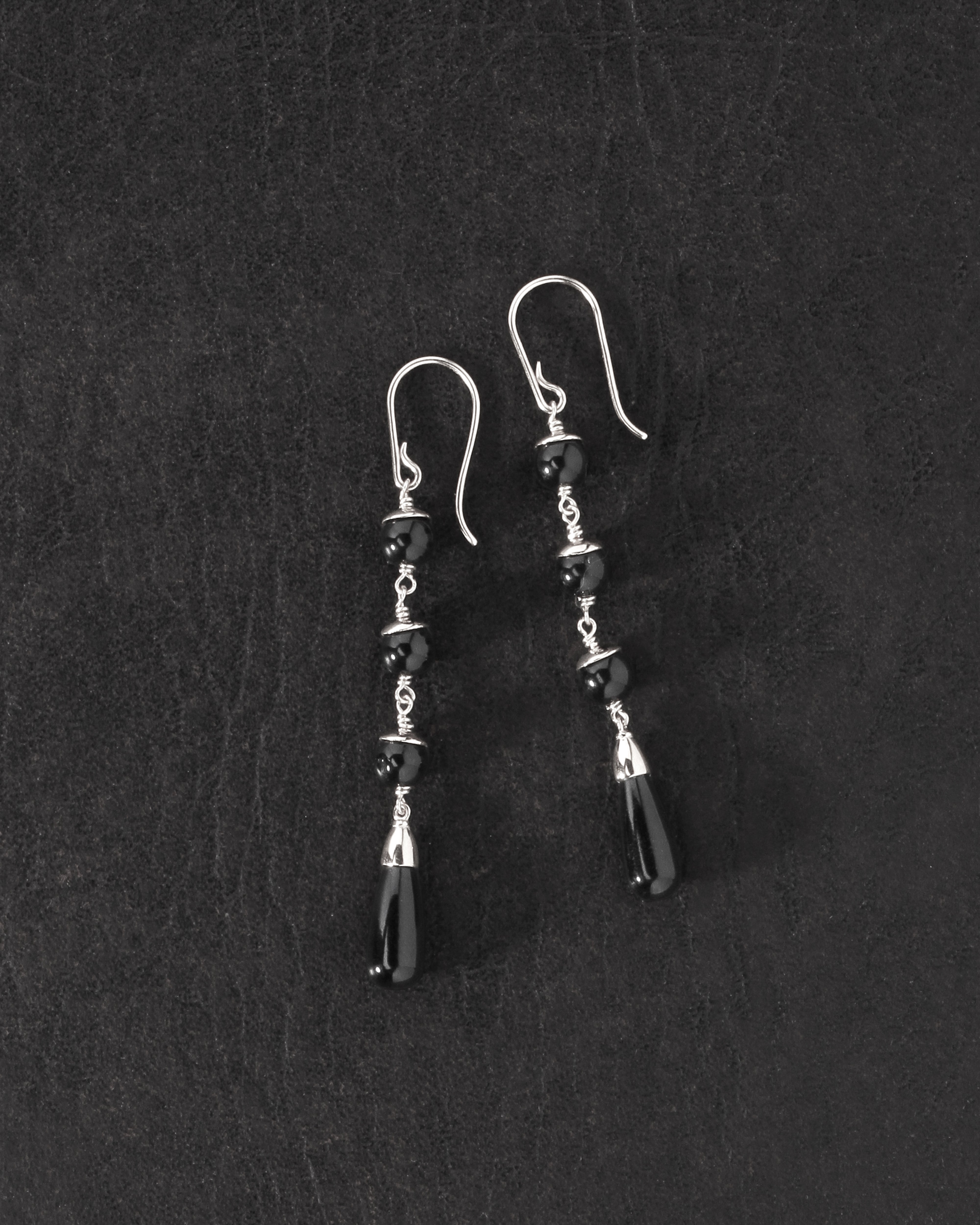 Sita Earrings Silver on dark leather