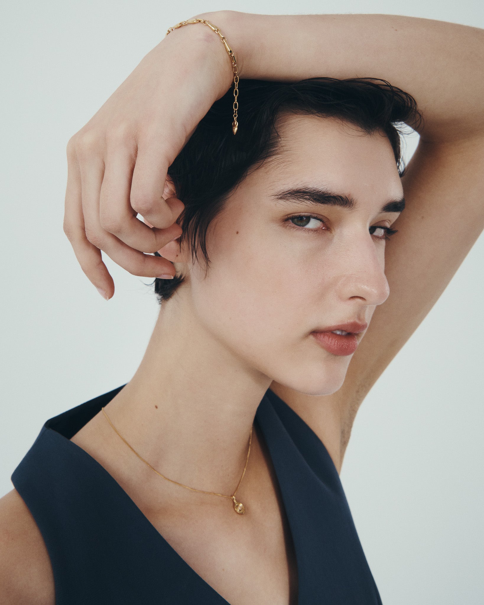 Soma Coin Necklace and Stilla Bracelet in Gold Vermeil, worn