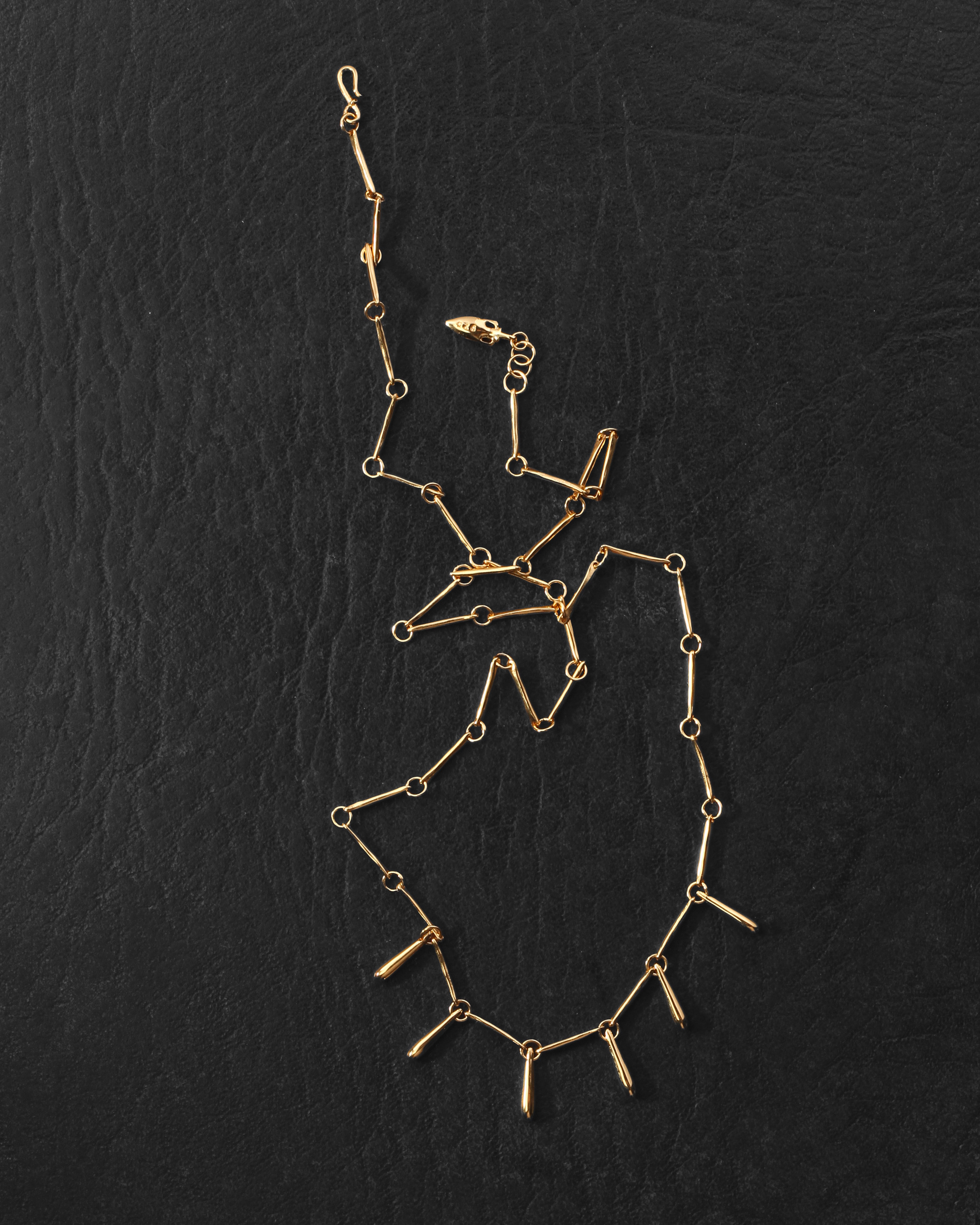 Stilla Necklace Gold Vermeil on dark leather